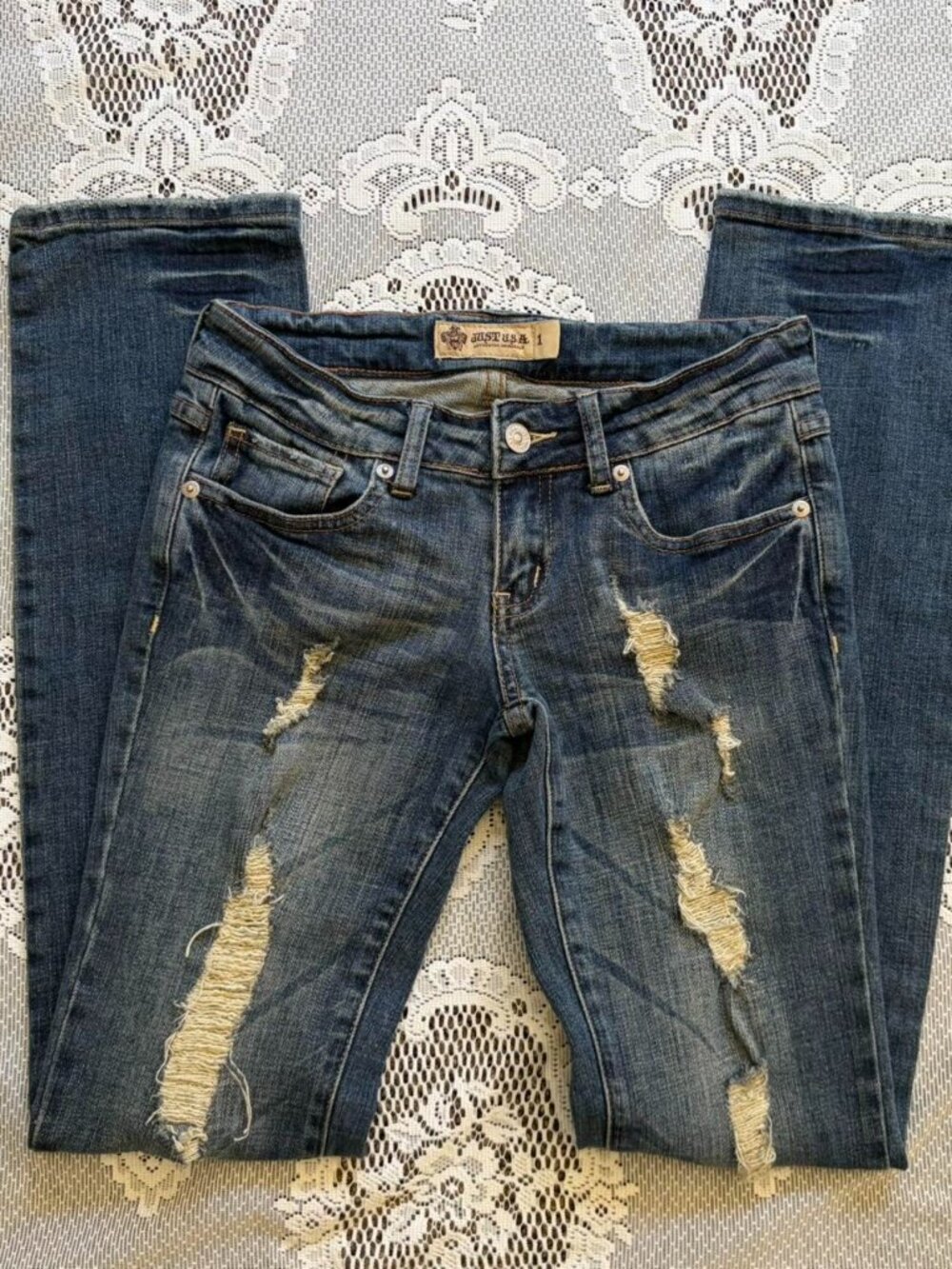 Distressed/ripped low rise bootcut/straight leg jeans